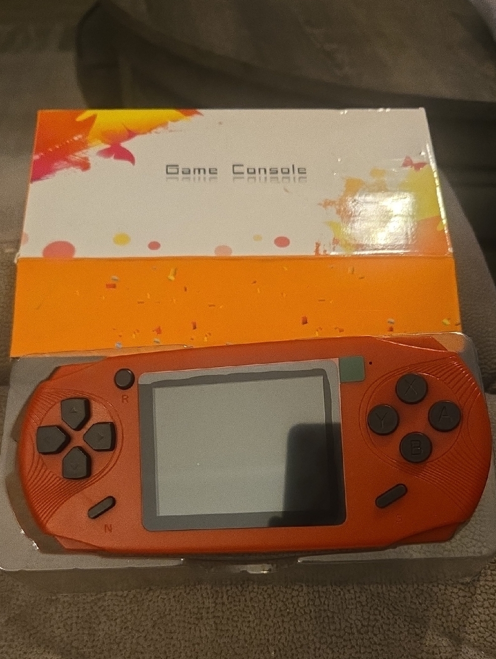 Portable Orange Handheld Game Console - Lightweight Retro Gaming Device